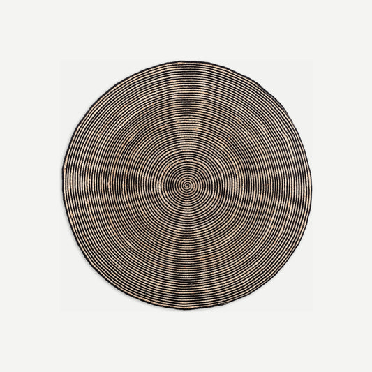 Alfombra Leandra Kodu redonda de algodón beige con detalles negros, trenzada a mano Ø180 cm