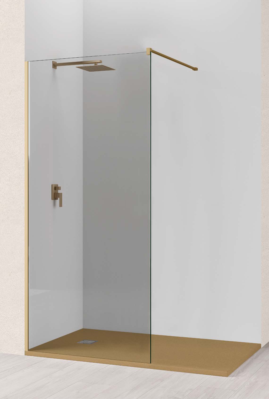 Mampara de ducha Manac Get Up & Design panel fijo con perfilería en oro mate en un baño luminoso